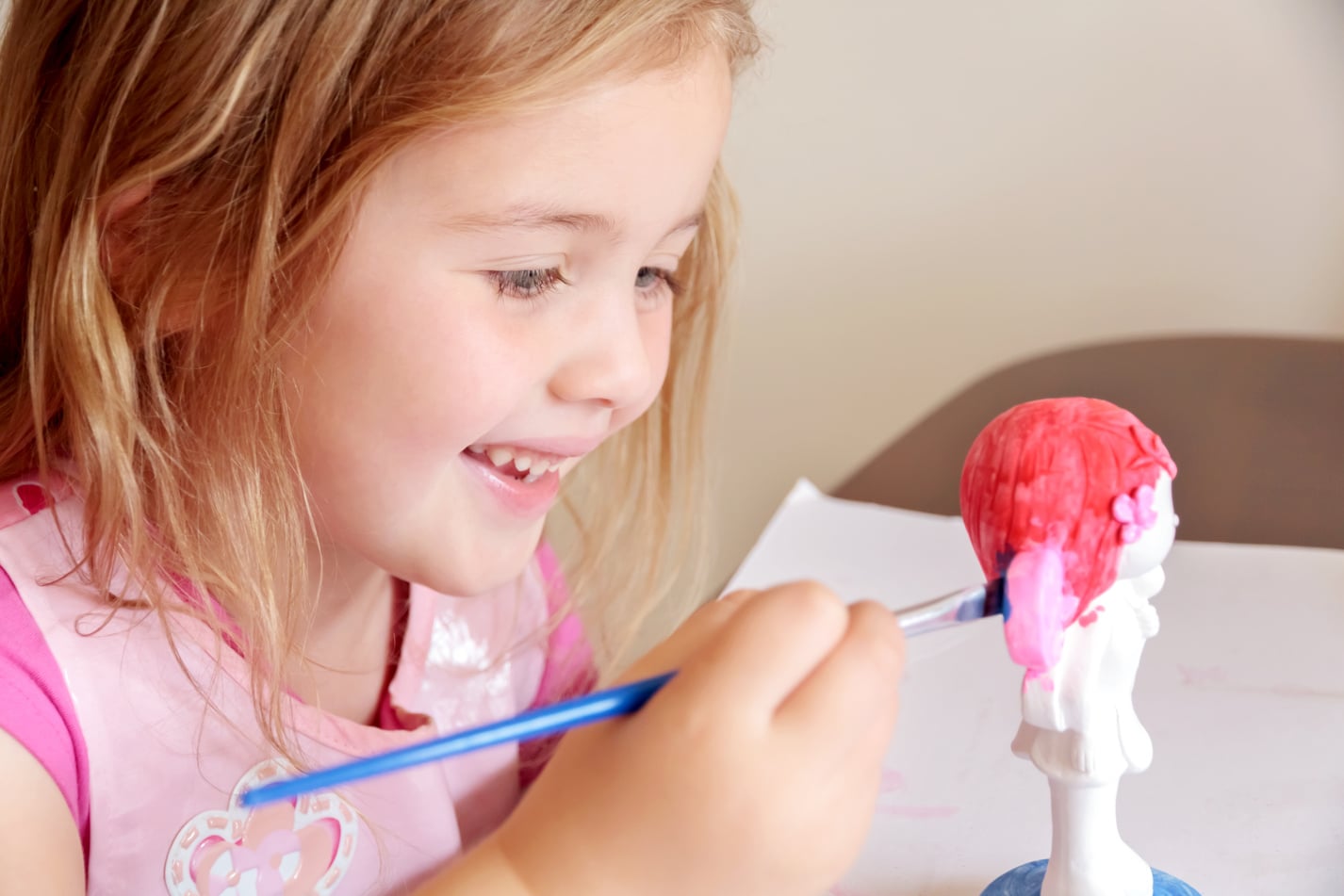 Little Girl Painting Pottery